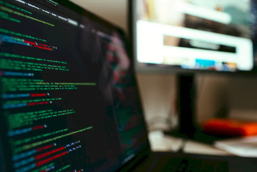 A bright pink sheet of paper used to wrap flowers curves in front of rich blue background
